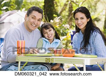 Stock Photo - hispanic family 
camping. fotosearch 
- search stock 
photos, pictures, 
images, and photo 
clipart