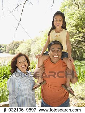 Picture - hispanic grandparents 
with granddaughter 
outdoors. fotosearch 
- search stock 
photos, pictures, 
images, and photo 
clipart