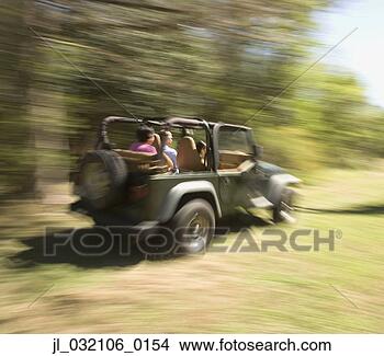 Stock Photo - blurred motion 
shot of people 
in jeep. fotosearch 
- search stock 
photos, pictures, 
images, and photo 
clipart