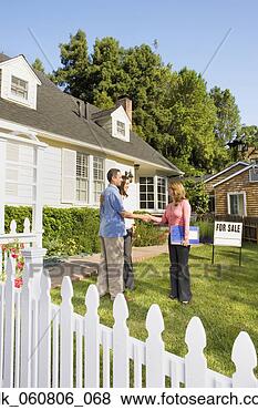 Stock Photo - couple shaking 
hands with real 
estate agent. 
fotosearch - search 
stock photos, 
pictures, images, 
and photo clipart