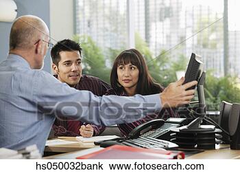Stock Photo - two businessmen 
and a businesswoman 
in a meeting. 
fotosearch - search 
stock photos, 
pictures, images, 
and photo clipart