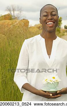 Stock Photo - african american 
woman with teacup 
outdoors. fotosearch 
- search stock 
photos, pictures, 
images, and photo 
clipart