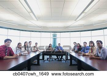 Stock Photograph - portrait of a 
group of business 
executives in 
a conference. 
fotosearch - search 
stock photos, 
pictures, images, 
and photo clipart