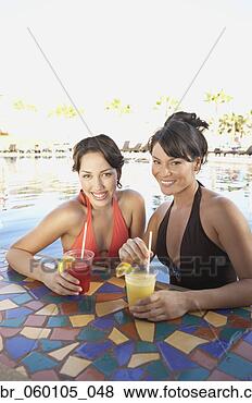 Stock Photo - two hispanic women 
at hotel pool 
bar, los cabos, 
mexico. fotosearch 
- search stock 
photos, pictures, 
images, and photo 
clipart