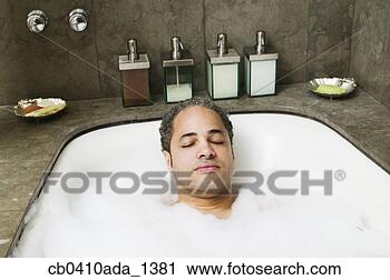 Stock Photography - young man taking 
a bubble bath. 
fotosearch - search 
stock photos, 
pictures, images, 
and photo clipart