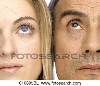 Stock Photo - close-up portrait 
of mature man 
and young woman 
looking up. fotosearch 
- search stock 
photos, pictures, 
images, and photo 
clipart