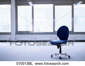 Stock Photo - empty office chair 
in deserted office 
space. fotosearch 
- search stock 
photos, pictures, 
images, and photo 
clipart