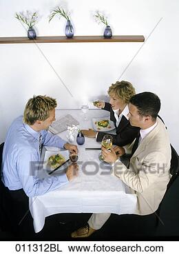 Stock Photo - group at business 
lunch having a 
controversial 
conversation. 
fotosearch - search 
stock photos, 
pictures, images, 
and photo clipart