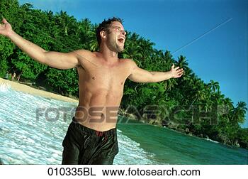Stock Photo - male caucasian 
(30-35 years) 
happy and joyful 
at the beach. 
fotosearch - search 
stock photos, 
pictures, images, 
and photo clipart