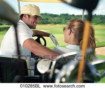 Stock Photo - models posing 
in electric caddy 
on golf course. 
fotosearch - search 
stock photos, 
pictures, images, 
and photo clipart