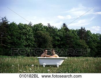 Stock Photo - portrait of two 
gay men sitting 
in bathtub outdoors. 
fotosearch - search 
stock photos, 
pictures, images, 
and photo clipart