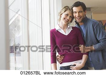 Stock Photo - casually dressed  mature couple.  fotosearch - search  stock photos,  pictures, images,  and photo clipart