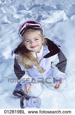 Stock Photo - portrait of young 
girl kneeling 
in snow wearing 
ski goggles. fotosearch 
- search stock 
photos, pictures, 
images, and photo 
clipart