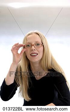 Stock Photo - portrait of blonde 
with spectacles. 
fotosearch - search 
stock photos, 
pictures, images, 
and photo clipart