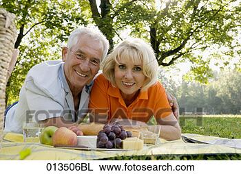 Stock Photo - portrait of smiling 
mature couple 
at picnic. fotosearch 
- search stock 
photos, pictures, 
images, and photo 
clipart