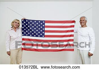 Stock Photo - two mature people 
showing stars 
and stripes. fotosearch 
- search stock 
photos, pictures, 
images, and photo 
clipart