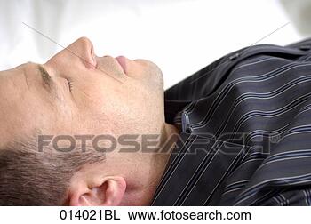 Stock Photo - close-up profile 
of man sleeping. 
fotosearch - search 
stock photos, 
pictures, images, 
and photo clipart