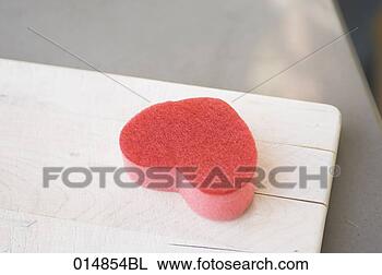Stock Photo - close-up of sponge 
in shape of heart. 
fotosearch - search 
stock photos, 
pictures, images, 
and photo clipart
