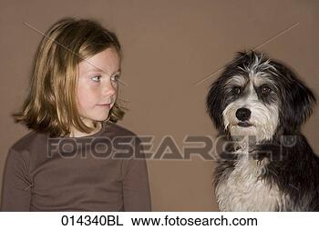 Stock Photo - girl looking at 
black and white 
pet dog. fotosearch 
- search stock 
photos, pictures, 
images, and photo 
clipart