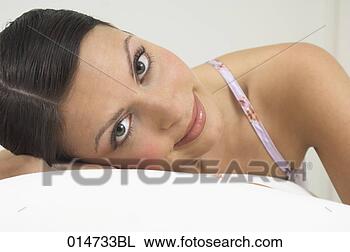 Stock Photo - headshot of beautiful 
young woman looking 
at camera. fotosearch 
- search stock 
photos, pictures, 
images, and photo 
clipart