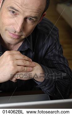 Stock Photo - headshot of man 
with notebook 
computer. fotosearch 
- search stock 
photos, pictures, 
images, and photo 
clipart