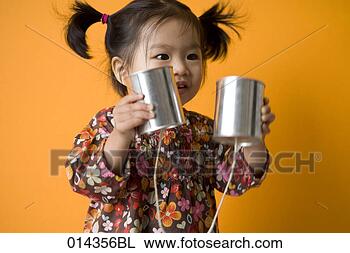 Stock Photo - little asian girl 
holding string 
telephone. fotosearch 
- search stock 
photos, pictures, 
images, and photo 
clipart