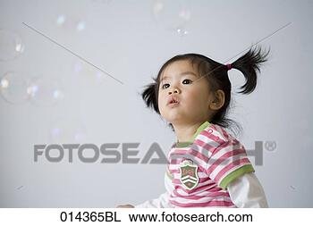 Stock Photo - little asian toddler 
looking at soap 
bubbles. fotosearch 
- search stock 
photos, pictures, 
images, and photo 
clipart