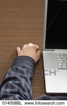 Stock Photo - male hand and 
laptop computer 
on table. fotosearch 
- search stock 
photos, pictures, 
images, and photo 
clipart