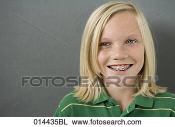 Stock Photo - portrait of smiling 
teenage boy with 
braces. fotosearch 
- search stock 
photos, pictures, 
images, and photo 
clipart
