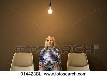 Stock Photo - sitting boy thinking 
under illuminated 
light bulb. fotosearch 
- search stock 
photos, pictures, 
images, and photo 
clipart