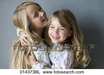 Stock Photo - two sisters in 
nightgowns embracing. 
fotosearch - search 
stock photos, 
pictures, images, 
and photo clipart