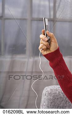 Stock Photo - close-up of hand 
holding ipod. 
fotosearch - search 
stock photos, 
pictures, images, 
and photo clipart