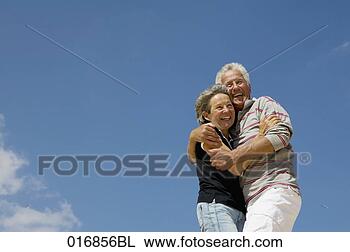 Stock Photo - mature couple 
embracing on beach. 
fotosearch - search 
stock photos, 
pictures, images, 
and photo clipart