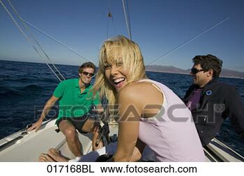 Stock Photo - portrait of young 
woman sitting 
with two friends 
on sailing boat. 
fotosearch - search 
stock photos, 
pictures, images, 
and photo clipart