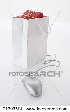 Stock Photo - still life of 
computer mouse 
and present in 
shopping bag. 
fotosearch - search 
stock photos, 
pictures, images, 
and photo clipart