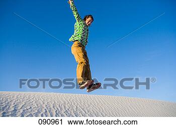 Stock Photography - marc romanelli, 
1 man only, 20s, 
adventure, blue 
sky, carefree. 
fotosearch - search 
stock photos, 
pictures, images, 
and photo clipart