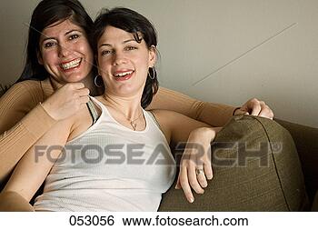 Stock Photo - two_people, two, 
two_persons, two_women, 
two_ladies. fotosearch 
- search stock 
photos, pictures, 
images, and photo 
clipart