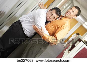 Stock Photo - businessman hugging 
another businessman. 
fotosearch - search 
stock photos, 
pictures, images, 
and photo clipart