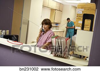 Stock Photo - medical professional 
working in hospital. 
fotosearch - search 
stock photos, 
pictures, images, 
and photo clipart