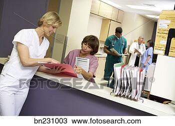 Stock Photo - medical professionals 
discussing paperwork. 
fotosearch - search 
stock photos, 
pictures, images, 
and photo clipart
