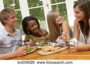 Stock Photo - teenagers making 
sandwiches. fotosearch 
- search stock 
photos, pictures, 
images, and photo 
clipart