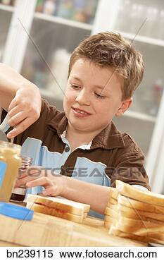 Stock Image - boy making peanut 
butter sandwich. 
fotosearch - search 
stock photos, 
pictures, images, 
and photo clipart