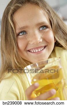 Stock Photo - girl with apple 
juice. fotosearch 
- search stock 
photos, pictures, 
images, and photo 
clipart