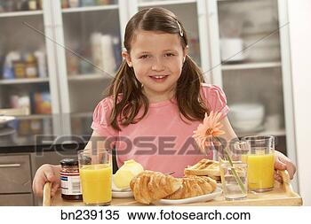 Stock Image - girl carrying 
breakfast tray. 
fotosearch - search 
stock photos, 
pictures, images, 
and photo clipart
