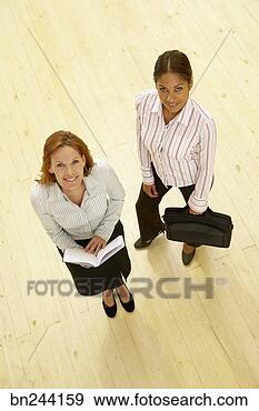 Stock Photograph - businesswomen 
with suitcase 
and day planner. 
fotosearch - search 
stock photos, 
pictures, images, 
and photo clipart