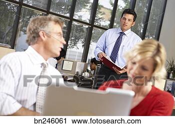 Stock Photography - co-workers collaborating. 
fotosearch - search 
stock photos, 
pictures, images, 
and photo clipart