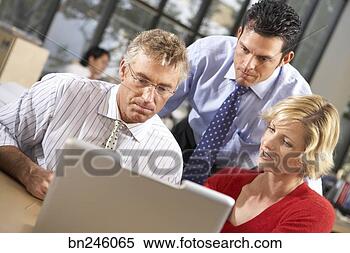 Stock Image - co-workers collaborating. 
fotosearch - search 
stock photos, 
pictures, images, 
and photo clipart