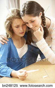 Stock Image - teen girls looking 
at pregnancy test. 
fotosearch - search 
stock photos, 
pictures, images, 
and photo clipart
