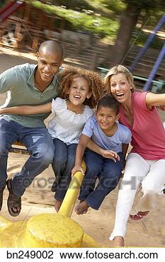 Stock Photo - family on merry-go-round. 
fotosearch - search 
stock photos, 
pictures, images, 
and photo clipart