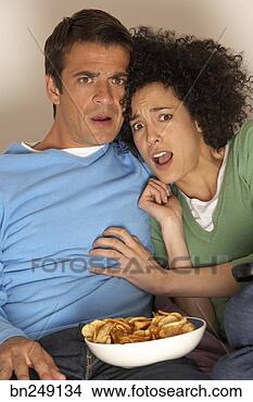 Stock Photo - shocked couple 
watching television. 
fotosearch - search 
stock photos, 
pictures, images, 
and photo clipart